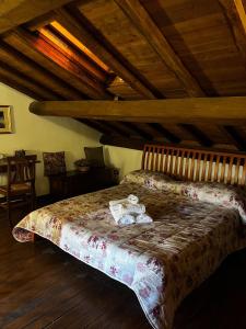 a bedroom with a bed with a teddy bear on it at La Loggetta in Valentano