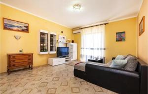 a living room with a couch and a television at Apartment Serda in Ugljan +20 photos