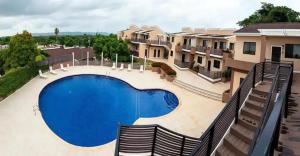 a large swimming pool in front of a building at Seaview Paradise - Sleeps 3 - Pool - Parking in Negril