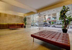 a room with a bed in the middle of a building at CABELLO SQUARE Security 24hs in Buenos Aires