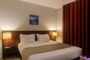 Cama ou camas em um quarto em Hotel Torre Mar