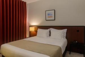 Cama ou camas em um quarto em Hotel Torre Mar