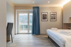 Postel nebo postele na pokoji v ubytování B&B A Un Passo Dal Lago, Caldonazzo