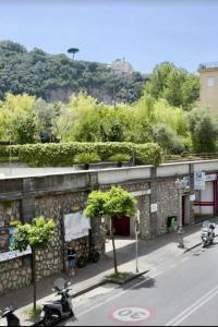 a street with two motorcycles parked in front of a building at Sorrento Realty Holidays Nagy House in Sant'Agnello