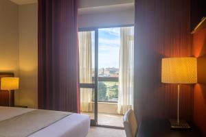 Cama ou camas em um quarto em Hotel Torre Mar