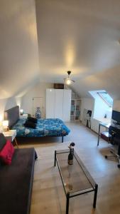 Ένα ή περισσότερα κρεβάτια σε δωμάτιο στο Le chaudron vert