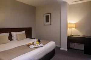 Cama ou camas em um quarto em Hotel Torre Mar