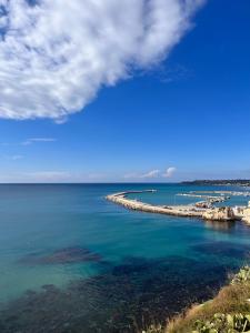 a view of a body of water with a pier at Colibri B&B in Sciacca
