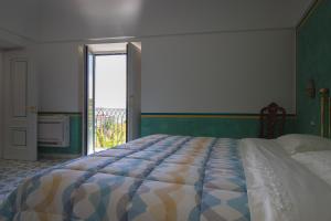 Postel nebo postele na pokoji v ubytování Villa La Zagara