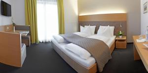 Posteľ alebo postele v izbe v ubytovaní Hotel Post Gries