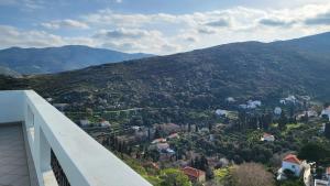 a view of a mountain from a balcony of a building at Eirini Home in Andros
