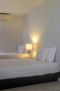 Cama ou camas em um quarto em Hotel Torre Mar