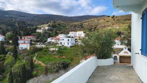 a view of a village from the balcony of a house at Eirini Home in Andros