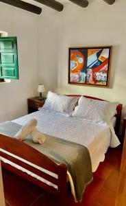 a bedroom with a large bed with at Hotel-Apartahotel Boutique Piedra & Luna in Villa de Leyva