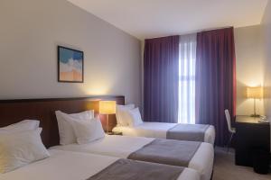 Cama ou camas em um quarto em Hotel Torre Mar