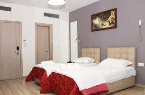 Postel nebo postele na pokoji v ubytování Hotel Relax