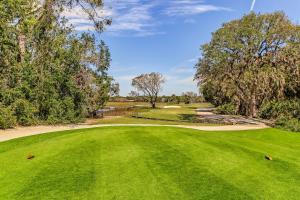 an image of a golf course with a green at 2023 Beach Wood in Fernandina Beach