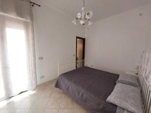 Postel nebo postele na pokoji v ubytování Fronte porto apartment 2