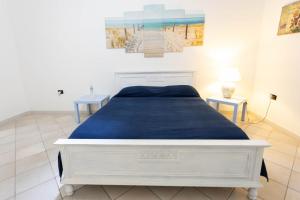Postel nebo postele na pokoji v ubytování DOMU DE TUNI Sa Buttega