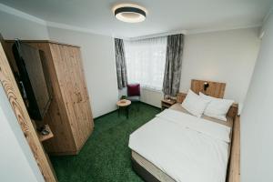Posteľ alebo postele v izbe v ubytovaní Apparthotel Samson