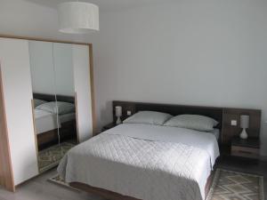 Postel nebo postele na pokoji v ubytování Appartment Ipsum