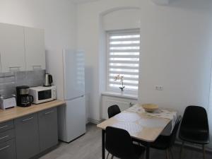 Kuchyň nebo kuchyňský kout v ubytování Appartment Ipsum
