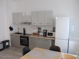 Kuchyň nebo kuchyňský kout v ubytování Appartment Ipsum