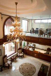 a large living room with a large chandelier at Capitol Residence in Vientiane