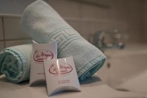 a couple of towels sitting on a counter in a bathroom at Hotel Wagner in Obertauern