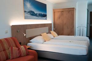 Łóżko lub łóżka w pokoju w obiekcie Hotel Wagner