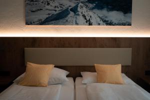 Łóżko lub łóżka w pokoju w obiekcie Hotel Wagner