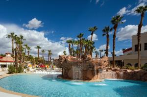 a swimming pool with a waterfall in a resort at Rio Hotel & Casino in Las Vegas