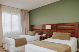 Postel nebo postele na pokoji v ubytování Hotel Limari