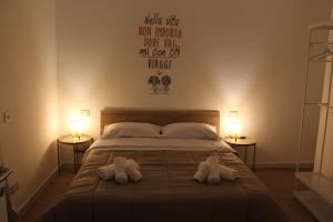 En eller flere senge i et værelse på Dimora Crispi 70