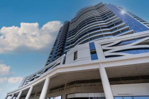 a tall building with the letter z on it at Appartement Dubai in Dubai +35 photos