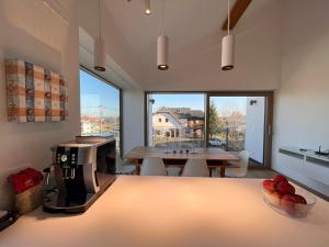 a kitchen with a coffee machine and a table at Villa Boris in Starše