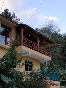 a building with a balcony and trees at Villa Stellia @drvacationsrental in La Laguna