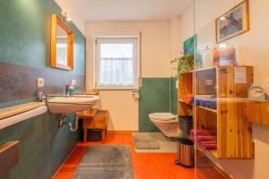 a bathroom with a sink and a toilet at Ruhe auf dem Land 1 - Maria in Aulendorf