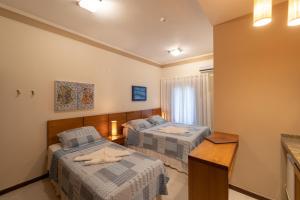 Cama ou camas em um quarto em Pousada do Almirante