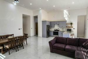 a living room and kitchen with a couch and a table at Villa Costa Felix 5 in Puerto Peñasco