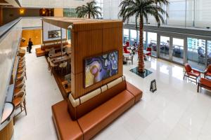 a lobby with a large couch in a mall at Roami at Brickell Penthouse Luxe Loft in Miami