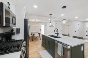 a kitchen with a sink and a stove at Spanish Fork Retreat in Spanish Fork
