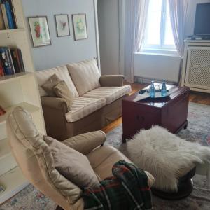 a living room with a couch and a coffee table at Rosindell cottage in Halle Westfalen
