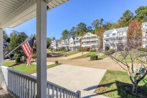 a view from the porch of a house with an american flag at House #46 Grits Carlton Lakefront (no pets) in Centre