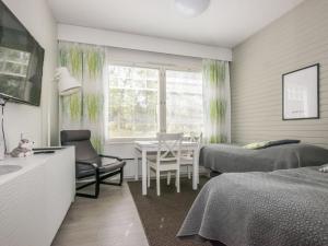 Postel nebo postele na pokoji v ubytování Holiday Home Rautulampi g15 by Interhome