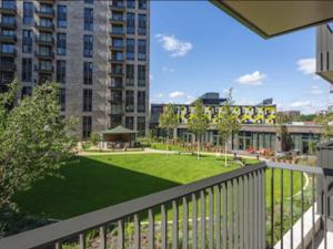 a view of a park from a balcony of a building at Apartment Wembley Park apartments-1 by Interhome in London