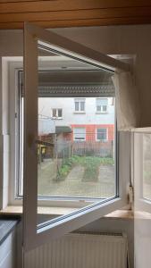 an open window with a view of a building at Monteurwohnung Heilbronn nahe Neckarsulm in Heilbronn