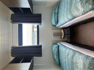 two bunk beds in a room with a window at Holiday Home De Parel by Interhome in Scherpenisse +18 photos