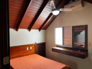 Tempat tidur dalam kamar di Pousada Residência Nativa