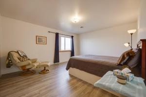 a hotel room with a bed and a chair at Malta Vacation Rental about 2 Mi to Town! in Malta